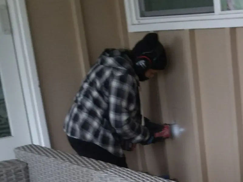 Professional electrician installing an exterior outlet in Cromwell